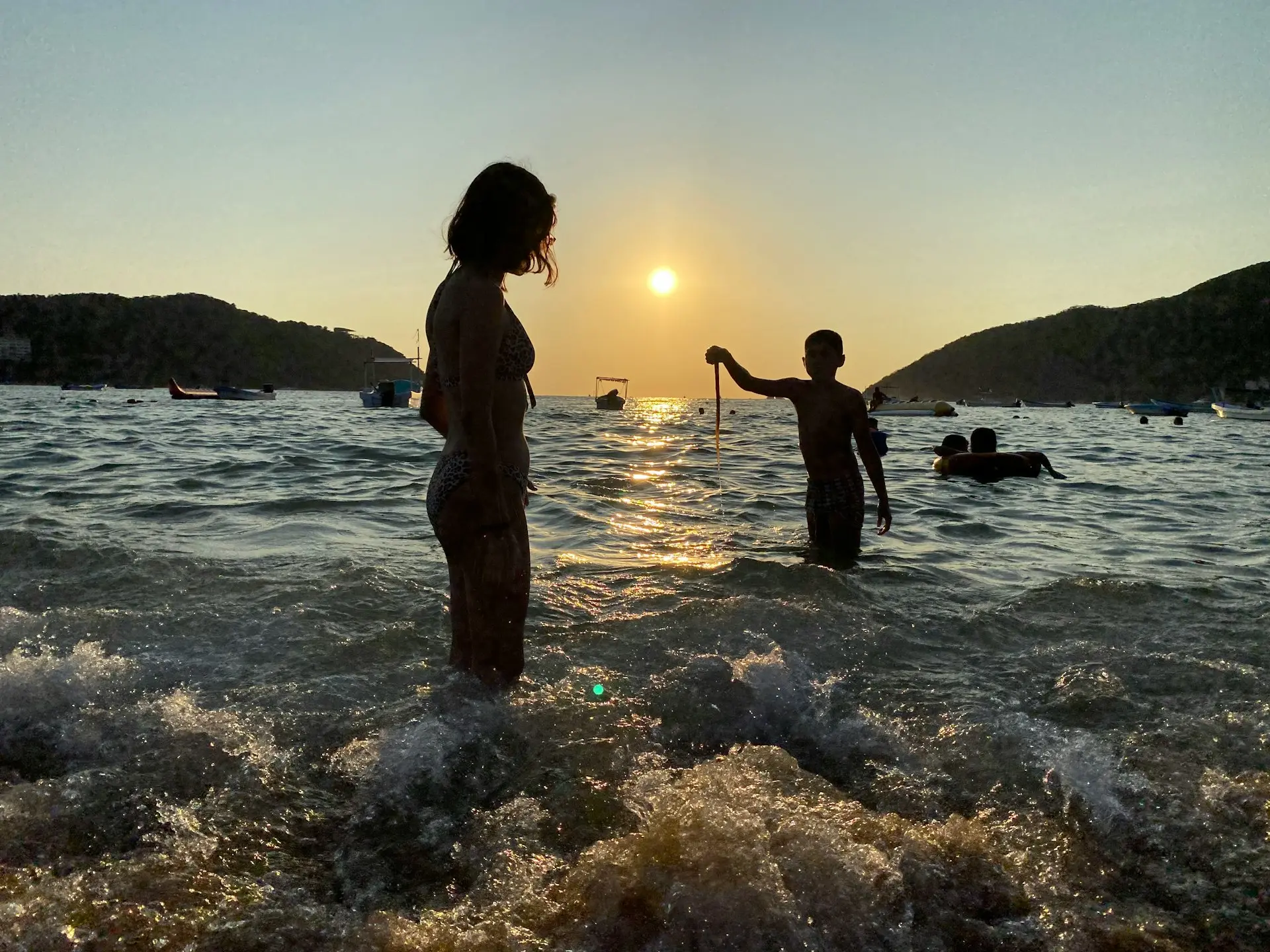 a couple of people standing in water